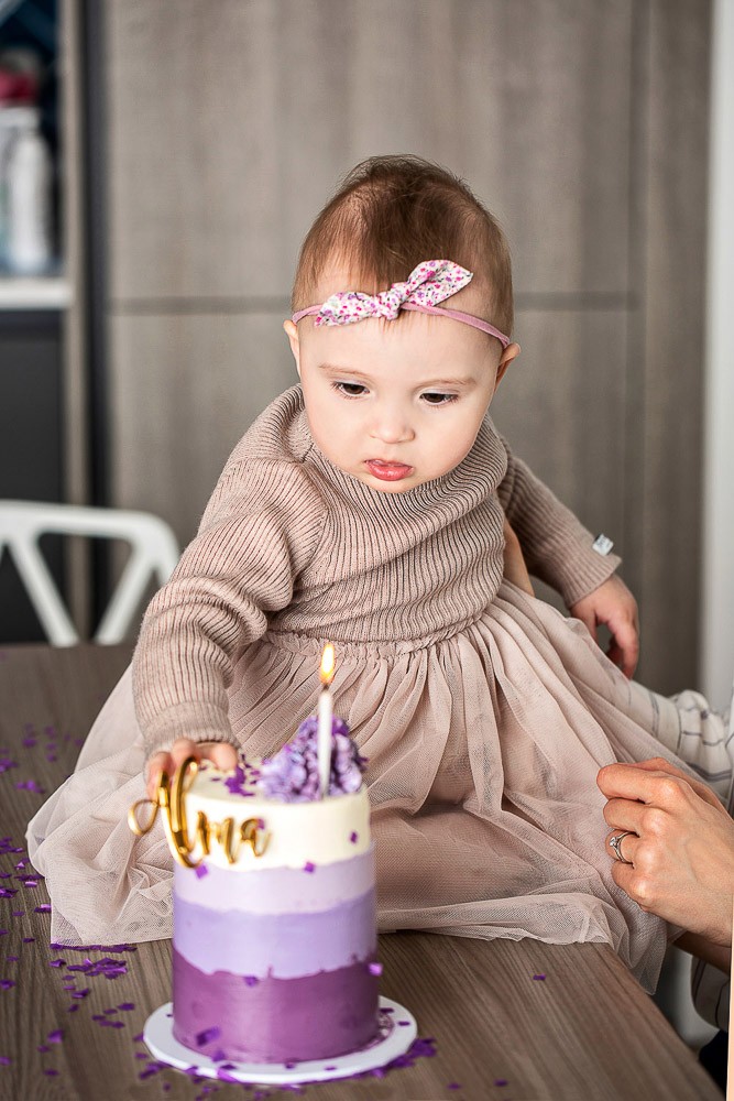 birthday cake for baby girl at first birthday session