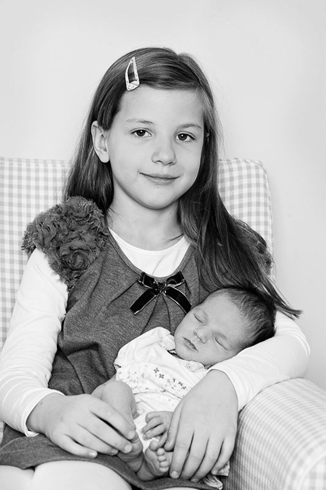 children portraits with newborn baby girl