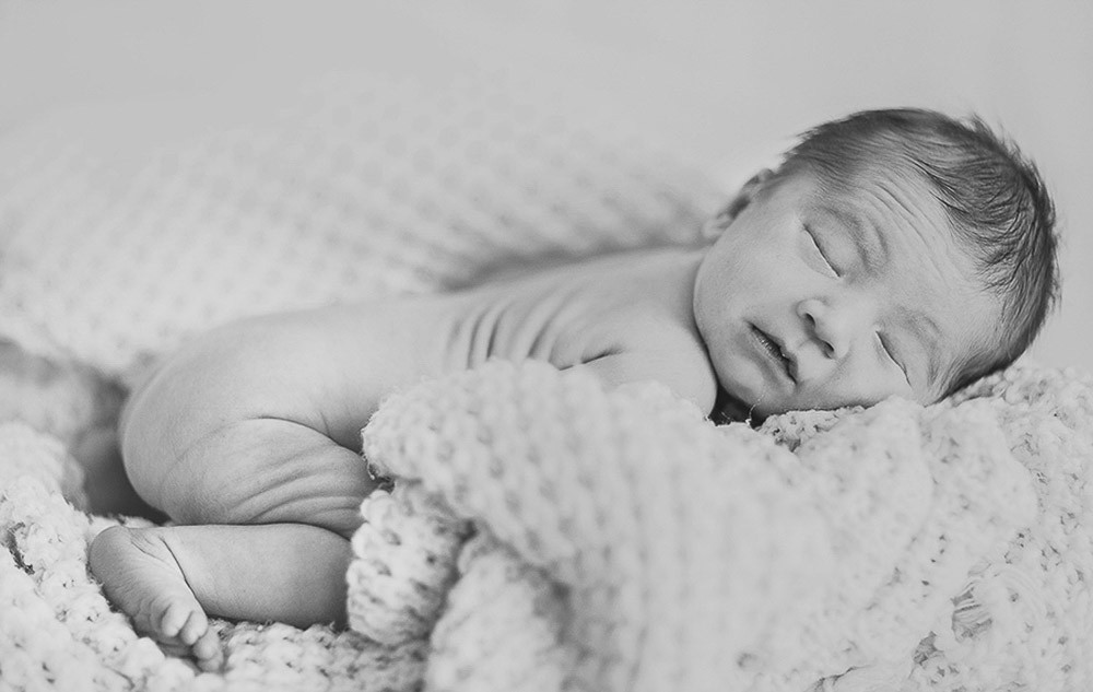 black and white newborn photography session at home